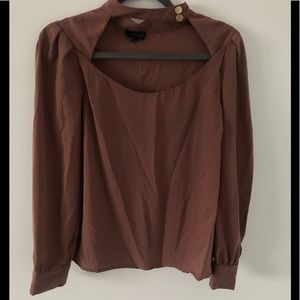 mauve blouse with open chest and neck choker